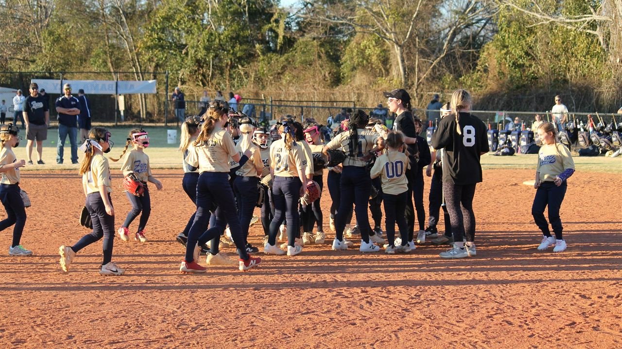 Fury teams gathering together on the infield after practice