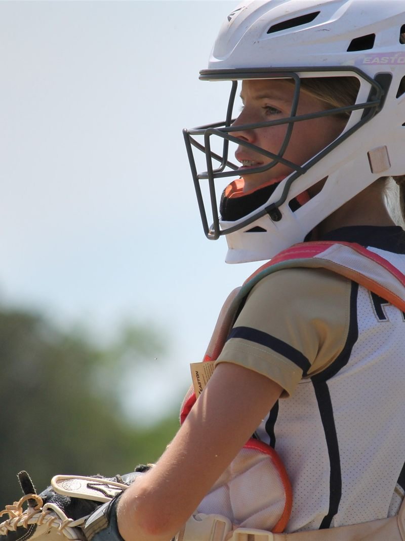 A Fury catcher in full gear, focused between pitches
