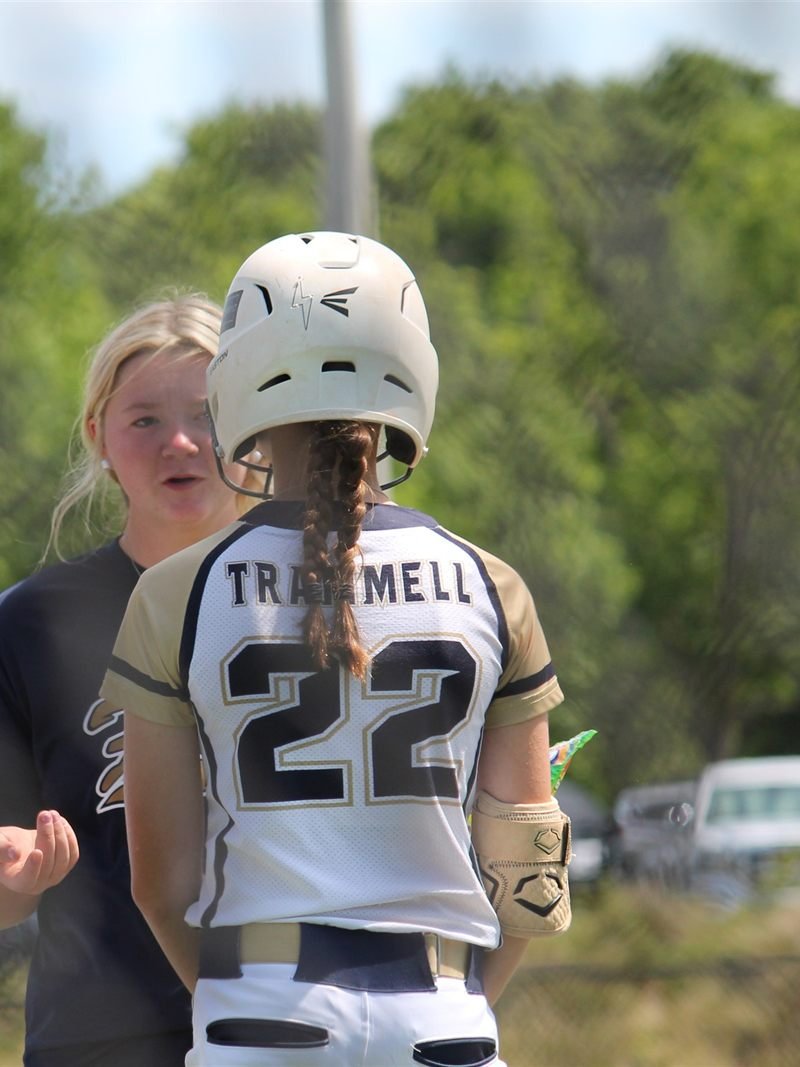 Two Fury teammates talking together between innings